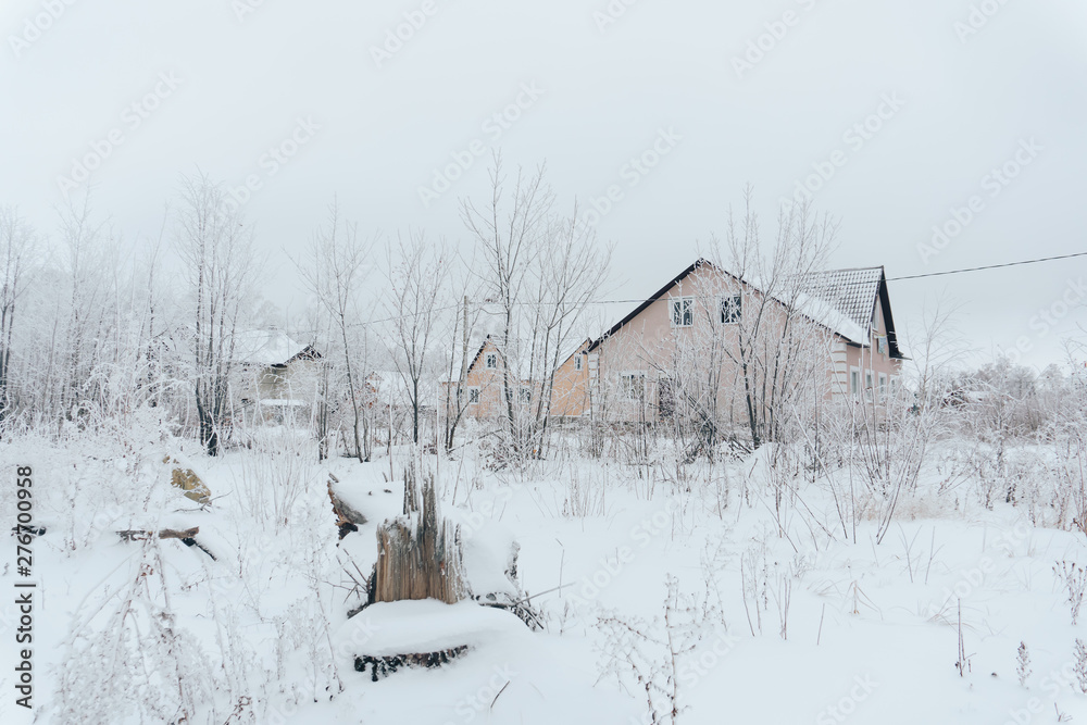 winter landscape with a small snow-covered house