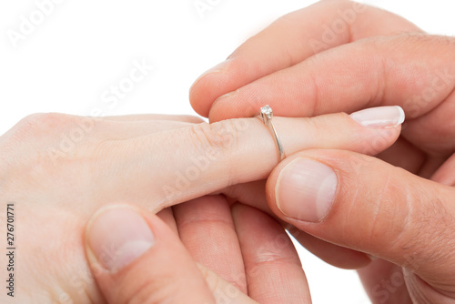 Closeup of engagement ring on finger