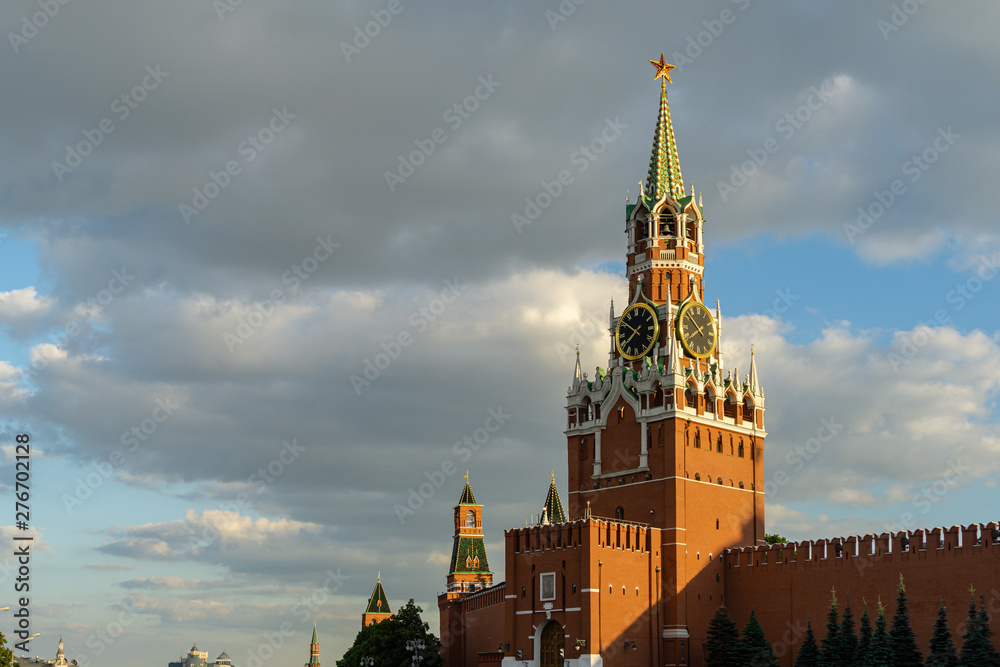 Fototapeta premium Evening summer view of Spasskaya Tower, the main tower of the Moscow Kremlin Red Square. Famous Kremlin chimes are historic clock on the Saviour Tower