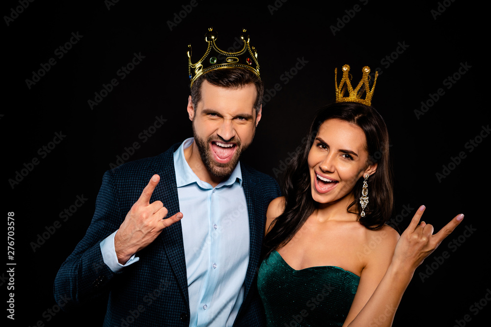 Close-up portrait of his he her she nice-looking gorgeous fascinating attractive luxury confident cheerful cheery two person life lifestyle showing rock roll sign isolated over black background Close-up portrait of his he her she nice-looking gorgeous fascinating attractive luxury confident cheerful cheery two person life lifestyle showing rock roll sign isolated over black background