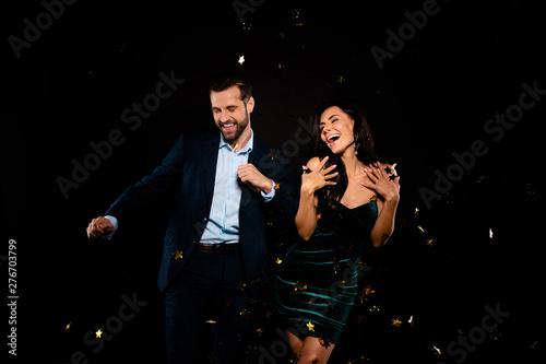 Portrait of his he her she nice-looking attractive glamorous smart cheerful crazy ecstatic overjoyed two person flying decorative elements having fun time amusement isolated on black background