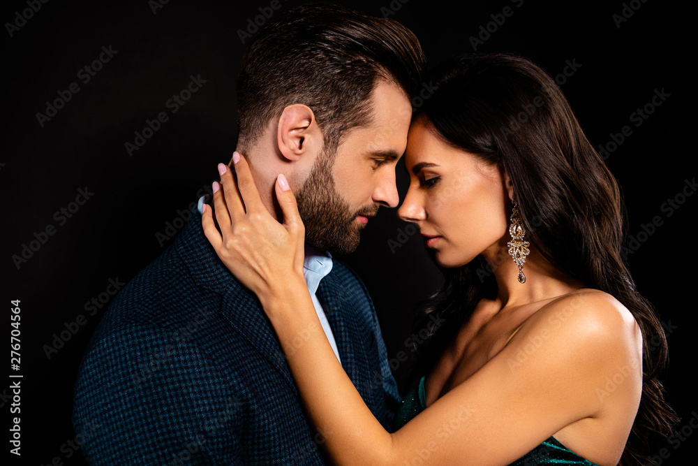 Close-up profile side view portrait of his he her she nice-looking attractive lovely luxurious passionate two person caressing St Valentine day event isolated over black background Close-up profile side view portrait of his he her she nice-looking attractive lovely luxurious passionate two person caressing St Valentine day event isolated over black background