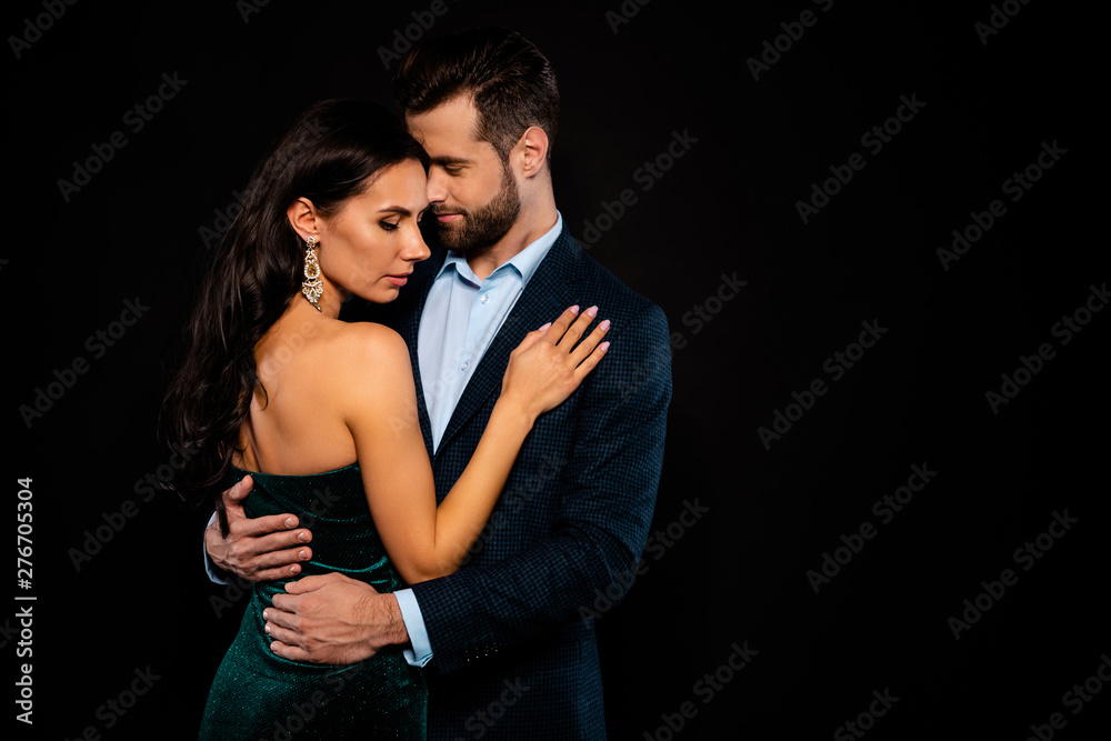 Close up side profile photo beautiful she her wife bride he him his husband fiance mrs mr married spouse protect hands slim waist hold close wear costume jacket green dress isolated black background Close up side profile photo beautiful she her wife bride he him his husband fiance mrs mr married spouse protect hands slim waist hold close wear costume jacket green dress isolated black background
