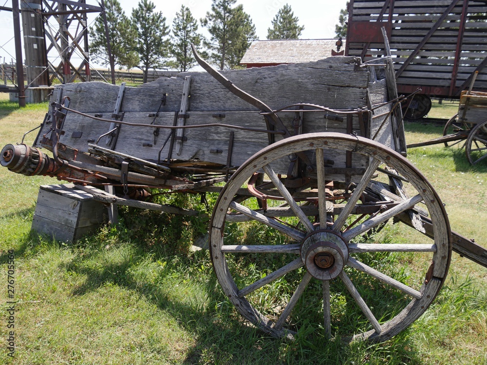 Close up of a dilapidated wooden wagon cart displayed in an 1880s town in South Dakota.