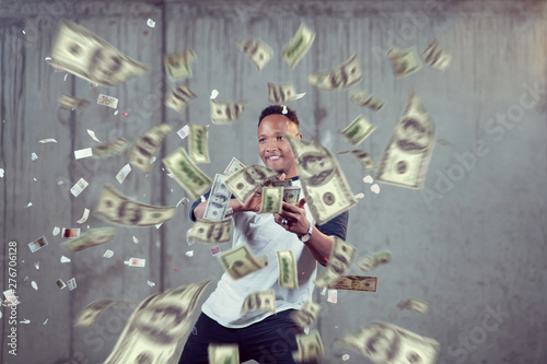 black businessman making the rain of money