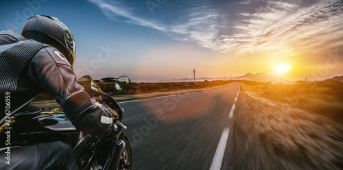 motorbike on the road riding. having fun driving the empty highway on a motorcycle tour journey