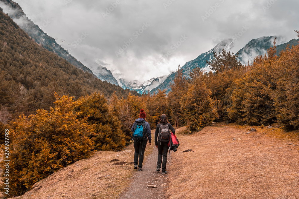 Two sisters trekking in the Aigüestortes National Park in the Pyrenees