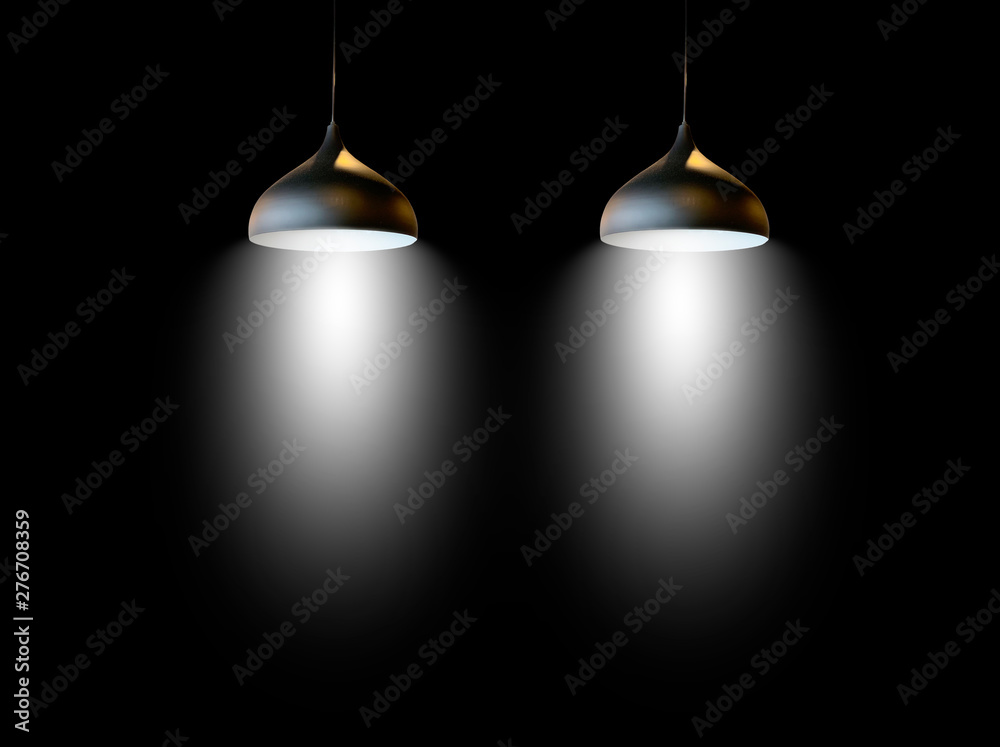 Black fixtures of lamp hanging on ceiling.