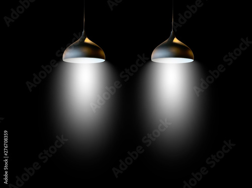 Black fixtures of lamp hanging on ceiling.