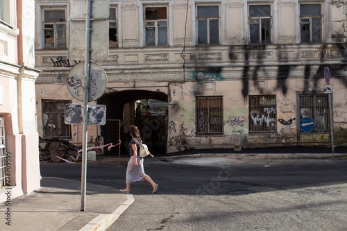 young woman walking on the street © tomminks