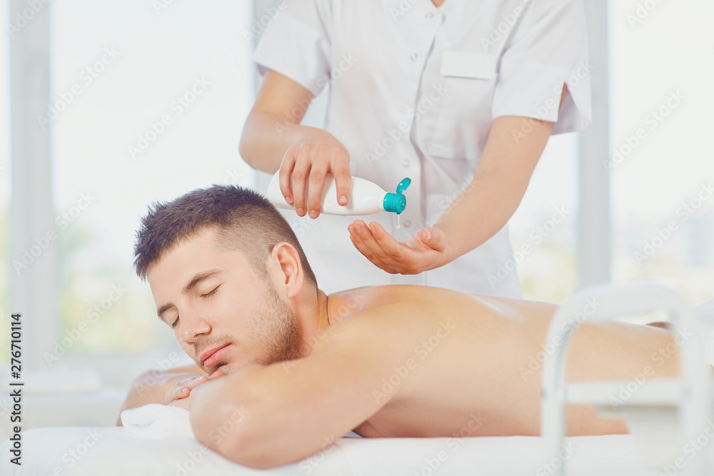 Man getting massage in the spa salon. . Man getting massage in the spa salon. .