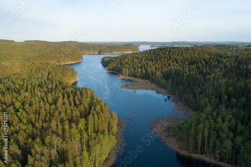  Aerial panoramic view of beautiful calm lake at sunset surrounded by forests. Kolovesi National park  Finland