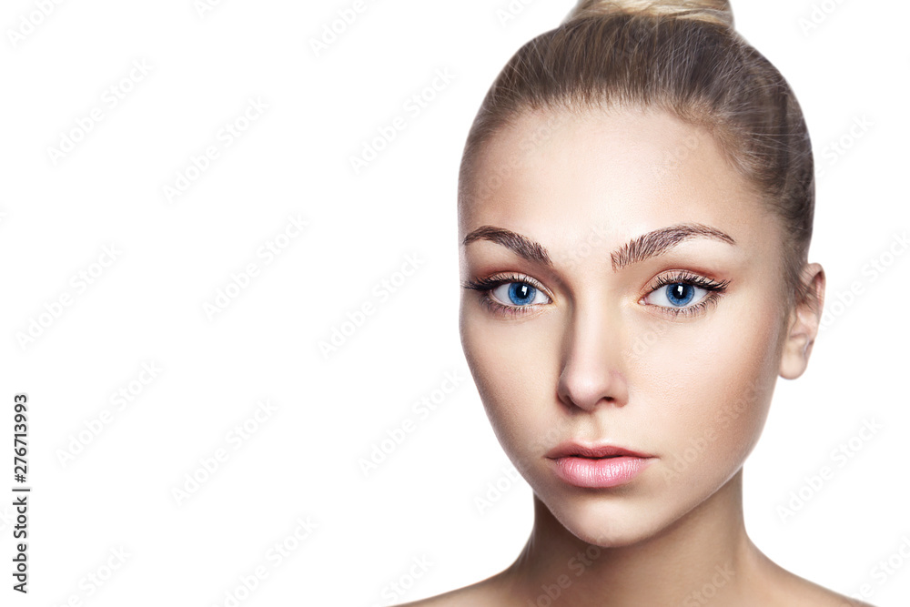 Portrait of young beautiful girl with long blond hair and natural make-up