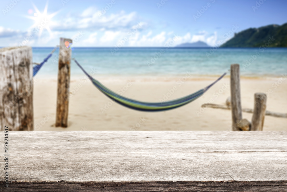 desk of free space and beach background 