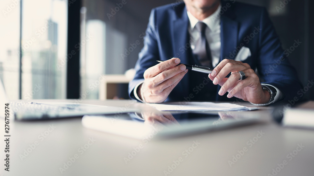 Businessman working on documents at office - obrazy, fototapety, plakaty 