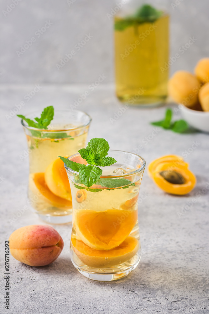 Fototapeta premium Summer drink, apricot mint tea. Selective focus, space for text.