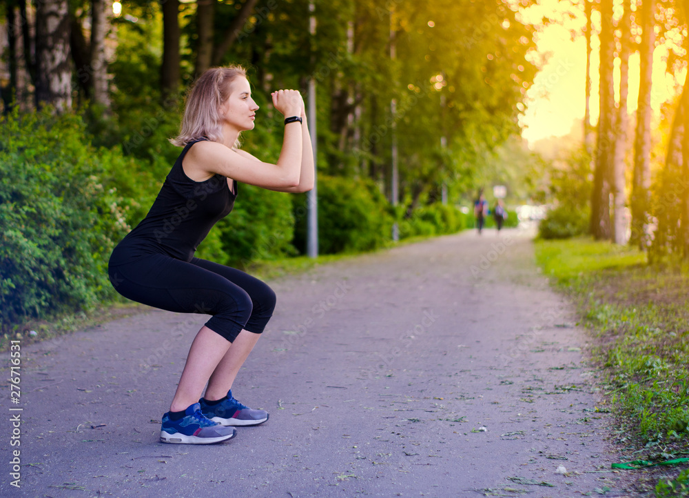Girl squatting. Healthy lifestyle. Exercises. Squat. Photo.