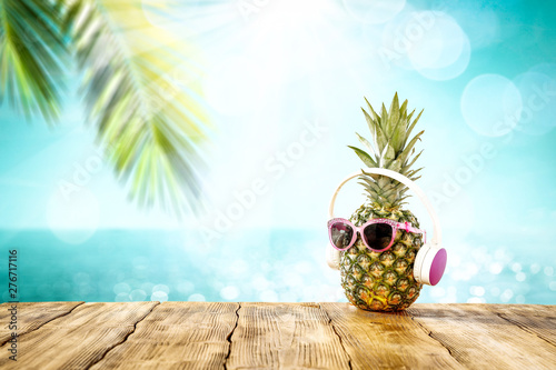 Desk of free space and pineapple fruit 