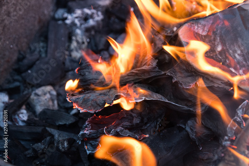 fire and black charcoal in a grill