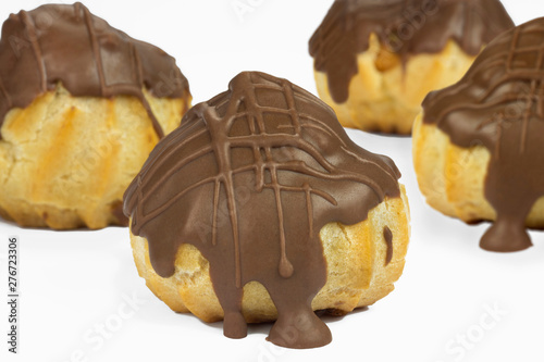 Traditional type of Brazilian profiterolis bakery candy called carolina in white background