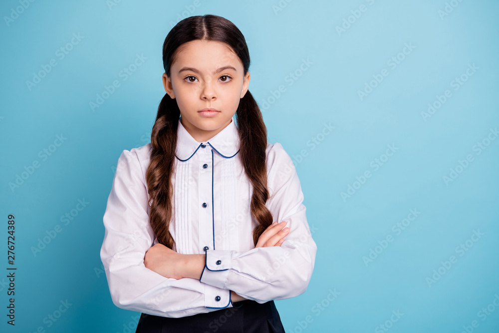 Portrait of charming focused kid look isolated over blue background Portrait of charming focused kid look isolated over blue background