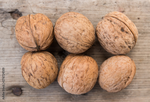 walnuts on a gray wooden board