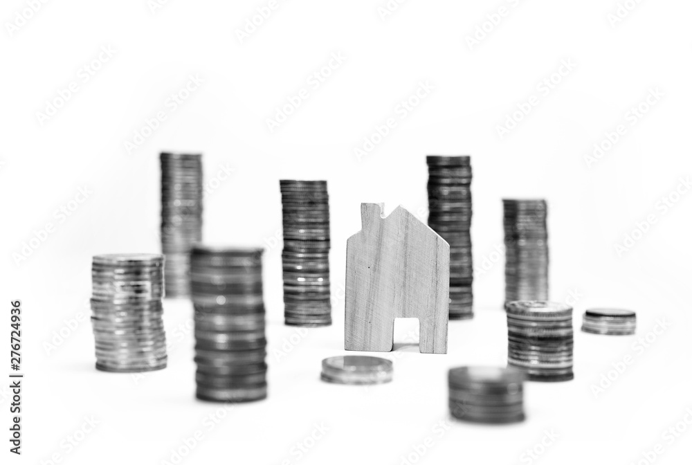House model on coin pile saving for concept with isolated on white background.Concept for property ladder, mortgage and real estate investment. home loan and Interest from the bank.