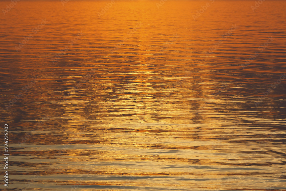 The miraculously golden sunset on water.