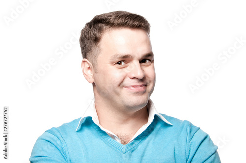 Smiling businessman on white background in studio.