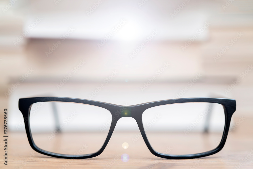 Glasses on background of books. Symbol of knowledge, science, study, wisdom.