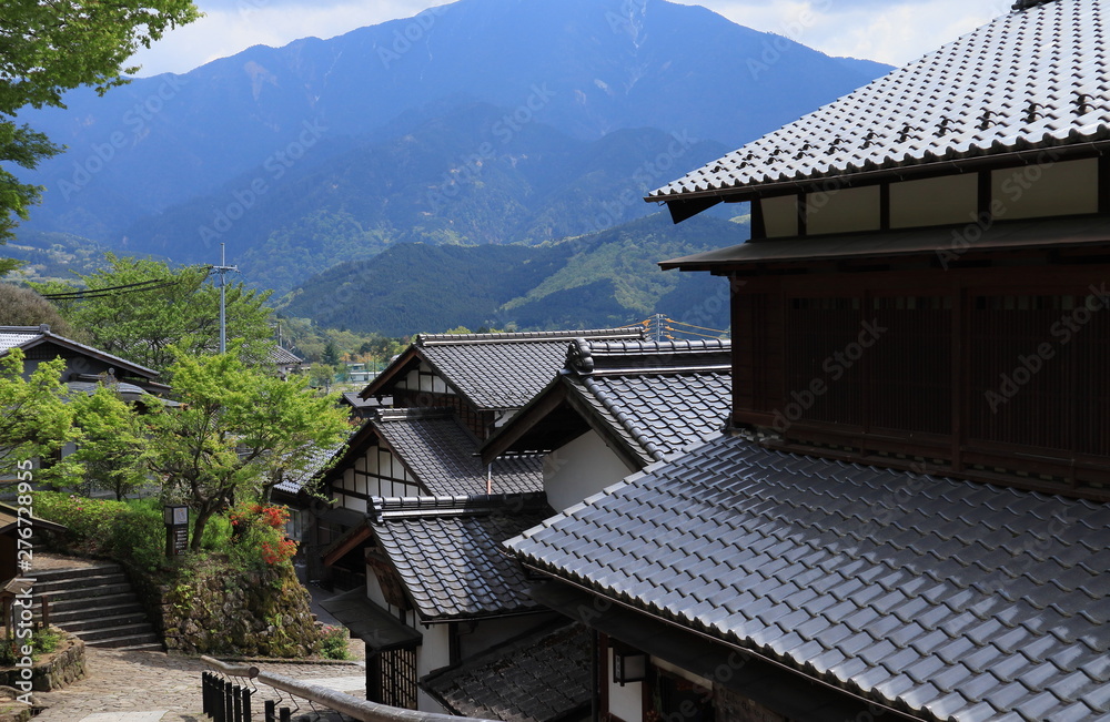 山間に建つ瓦屋根の日本家屋stock Photo Adobe Stock