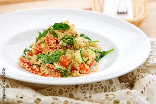 An easy  zesty summer salad with a Mediterranean flair featuring Israeli couscous and chopped summer vegetables