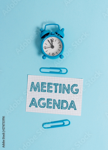Obraz na płótnie Handwriting text writing Meeting Agenda. Conceptual photo items that participants hope to accomplish at a meeting Alarm clock wakeup squared blank paper sheet clips colored background w salonie