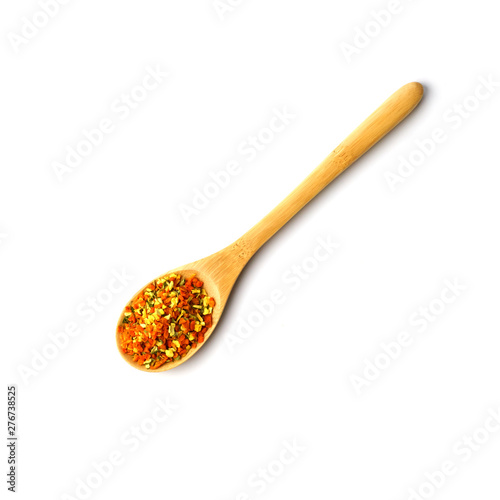 wooden spoon with spices of dry herbs and vegetables