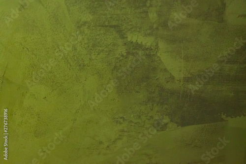 Structural plaster. Creative vintage background. The background is green.