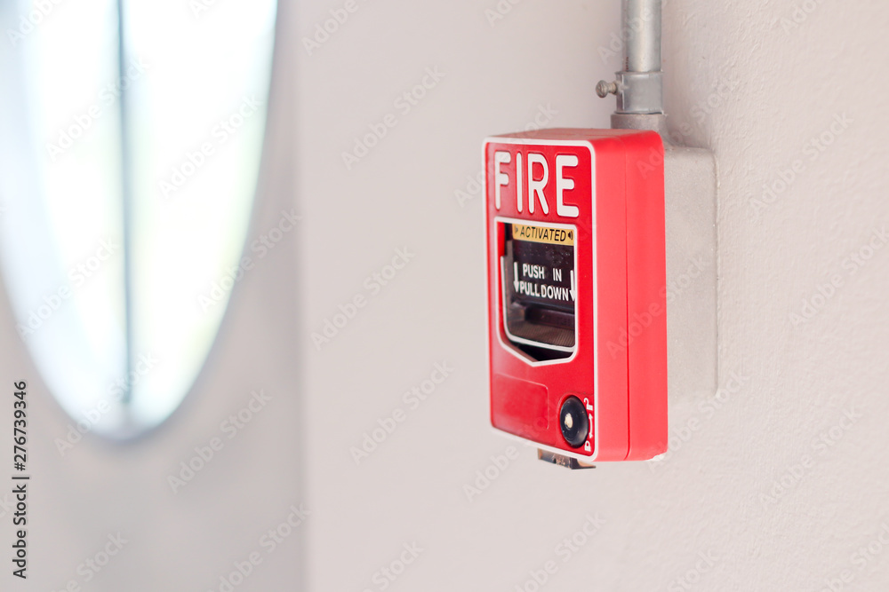 Fire alarm switch on the wall in factory. Fire alarm switch on the wall in factory.