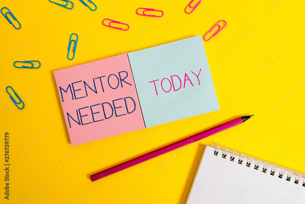 Handwriting text Mentor Needed. Conceptual photo wanted help for more experienced or more knowledgeable demonstrating Colored square blank sticky spiral notepads pencil clips color background