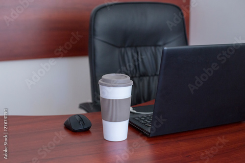 Laptop on a table at modern office