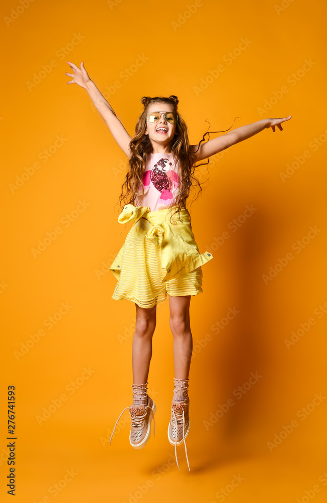 Fashion and people concept: stylish girl in casual clothes, posing Fashion and people concept: stylish girl in casual clothes, posing