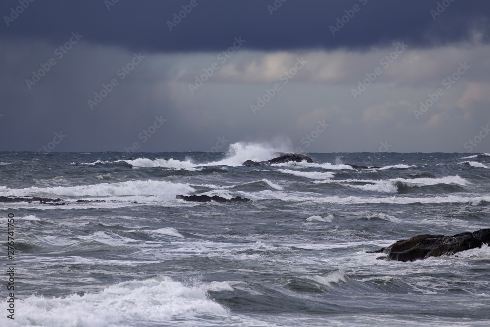 Seascape with rain on the horizon