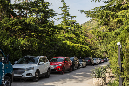 Cars in the parking lot along the street