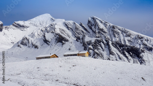 Traditional wooden houses on the mountainside in Grindelwald, Switzerland.