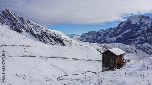 Traditional wooden houses on the mountainside in Grindelwald, Switzerland.