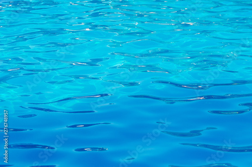 Clear transparent light blue water in the pool. Texture, water background in the pool_