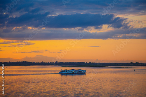 A beautiful golden sunset on the river. © Julia Kiseleva