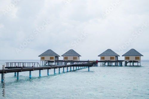 Fototapeta Naklejka Na Ścianę i Meble -  Water Villas and wooden bridge at Tropical beach in the Maldives