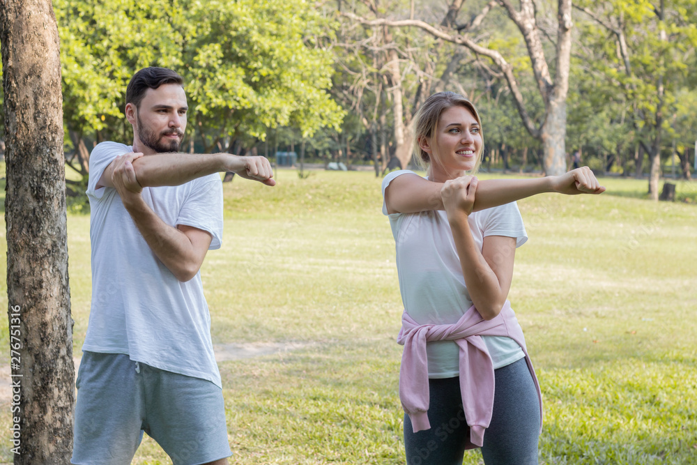 Couples are exercising in the park. Couples are exercising in the park.