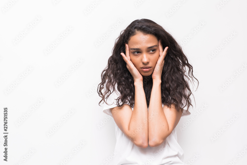 Young woman has headache on gray background Young woman has headache on gray background