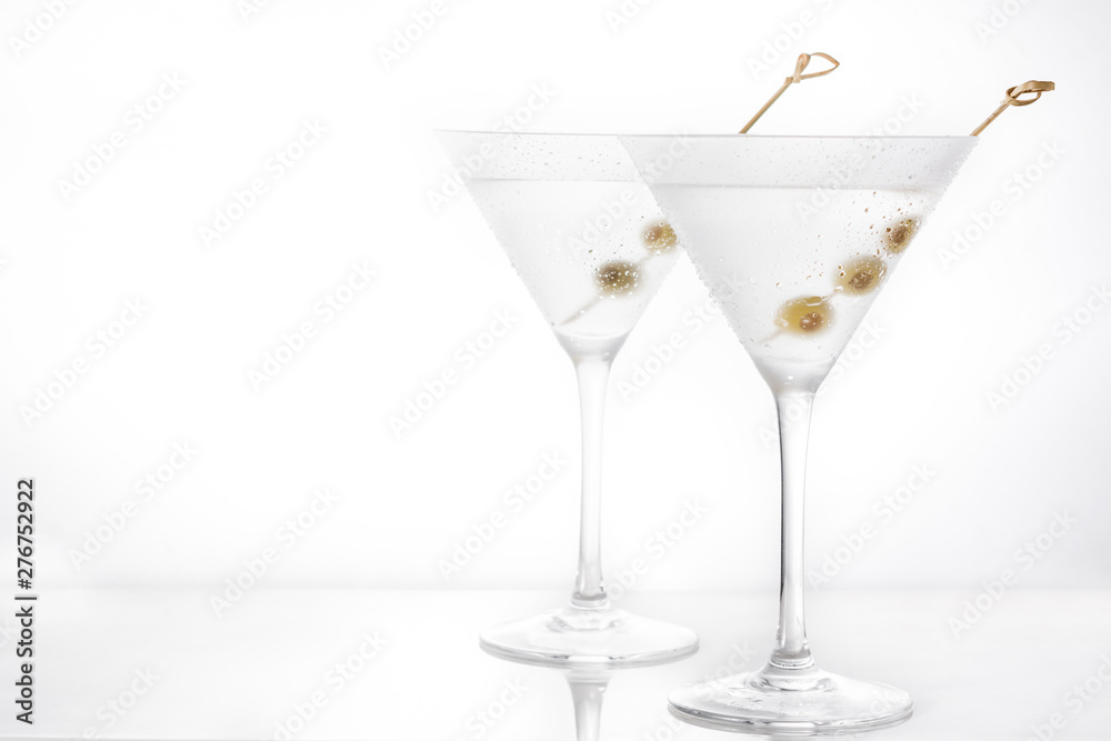 Classic Dry Martini with olives isolated on white background. Copyspace