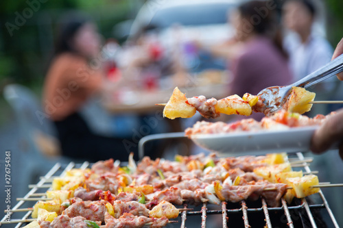 Barbeque Grill Street Food in thailand,Eat outdoors in a happy family. holiday celebration concept